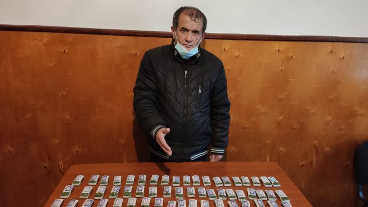 Həyətində narkotik basdırdı